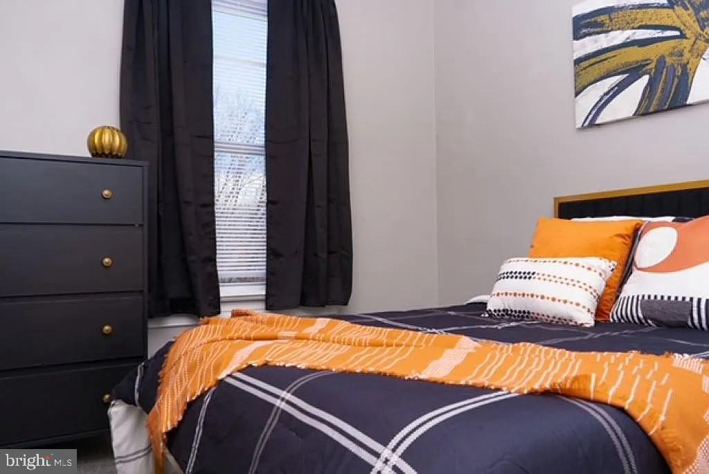 3041 Mathews Street Baltimore, MD 21218 - Photo 6 of 12 Cozy bedroom with vibrant accents.