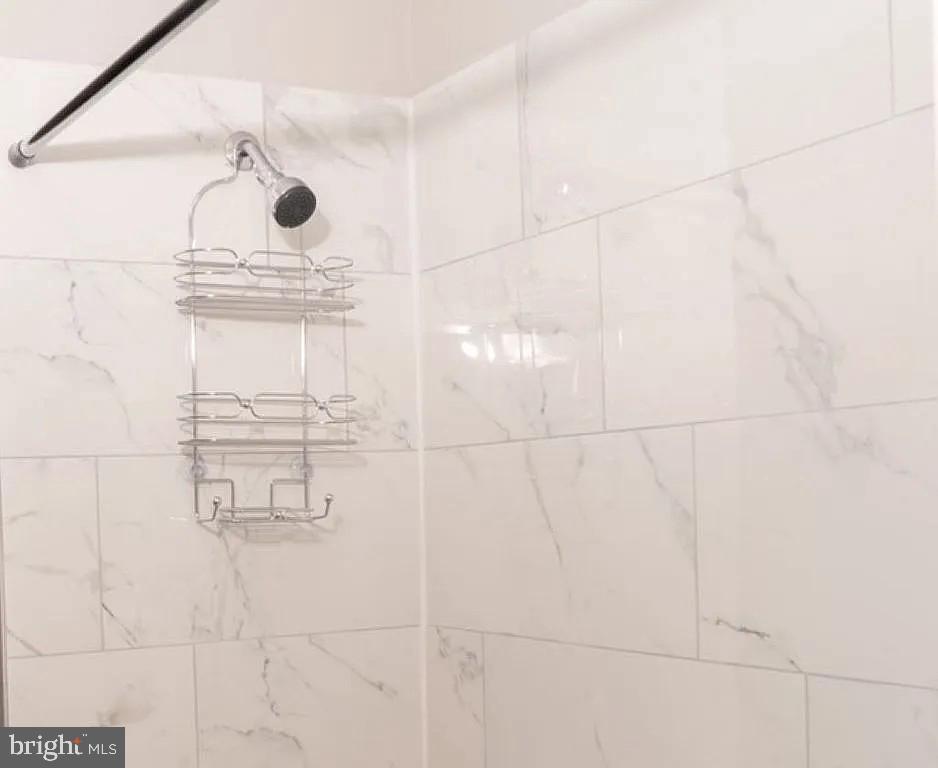 3041 Mathews Street Baltimore, MD 21218 - Photo 8 of 12 Sleek marble shower retreat.