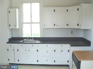 226 Chestnut Street Spring City, PA 19475 - Photo 6 of 6 a kitchen with granite countertop white cabinets and a sink