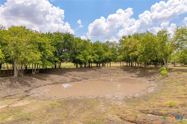a view of a playground with basketball court