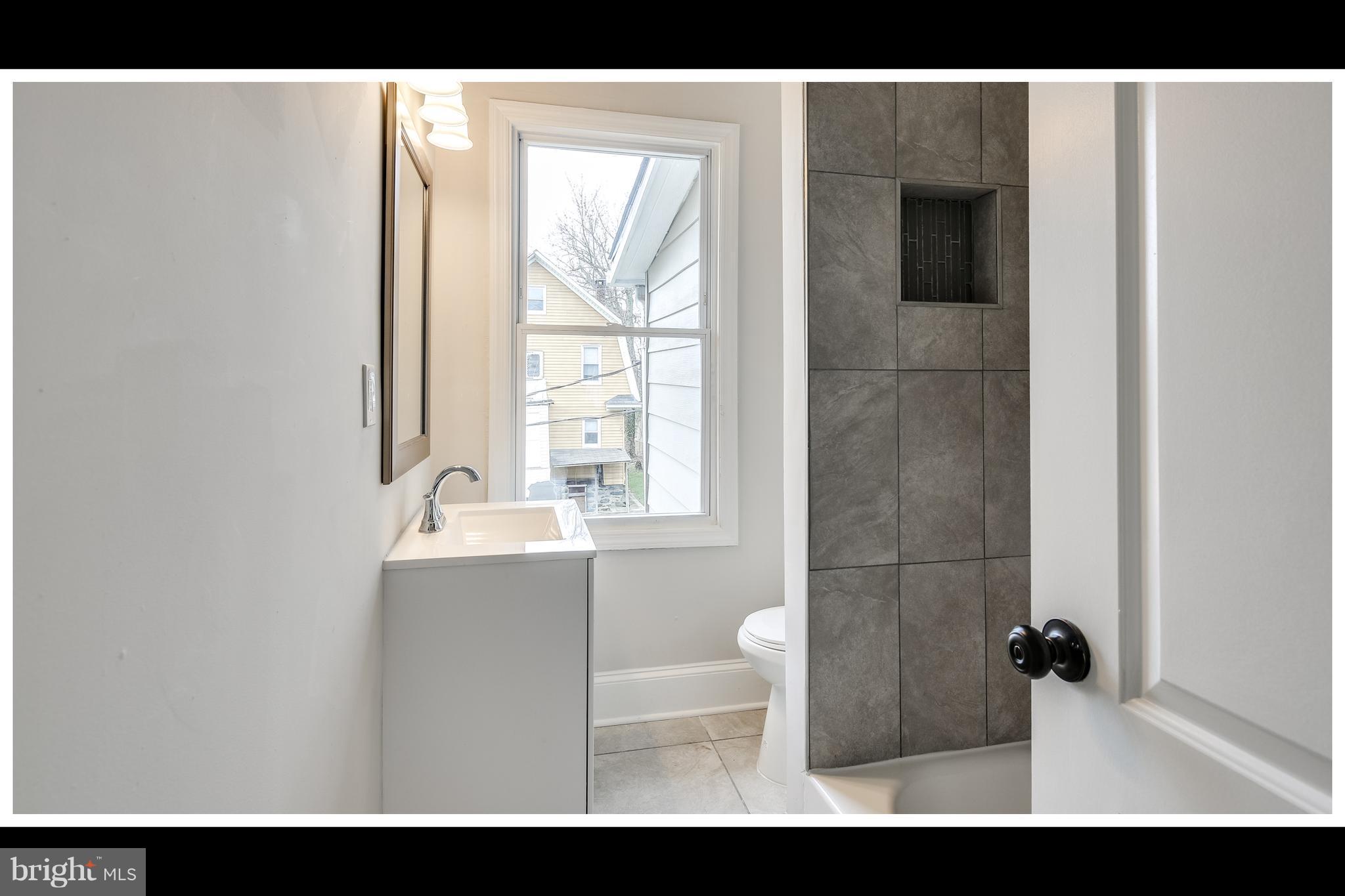 2900 Allendale Road Baltimore, MD 21216 - Photo 22 of 29 a view of bathroom with bathtub and shower