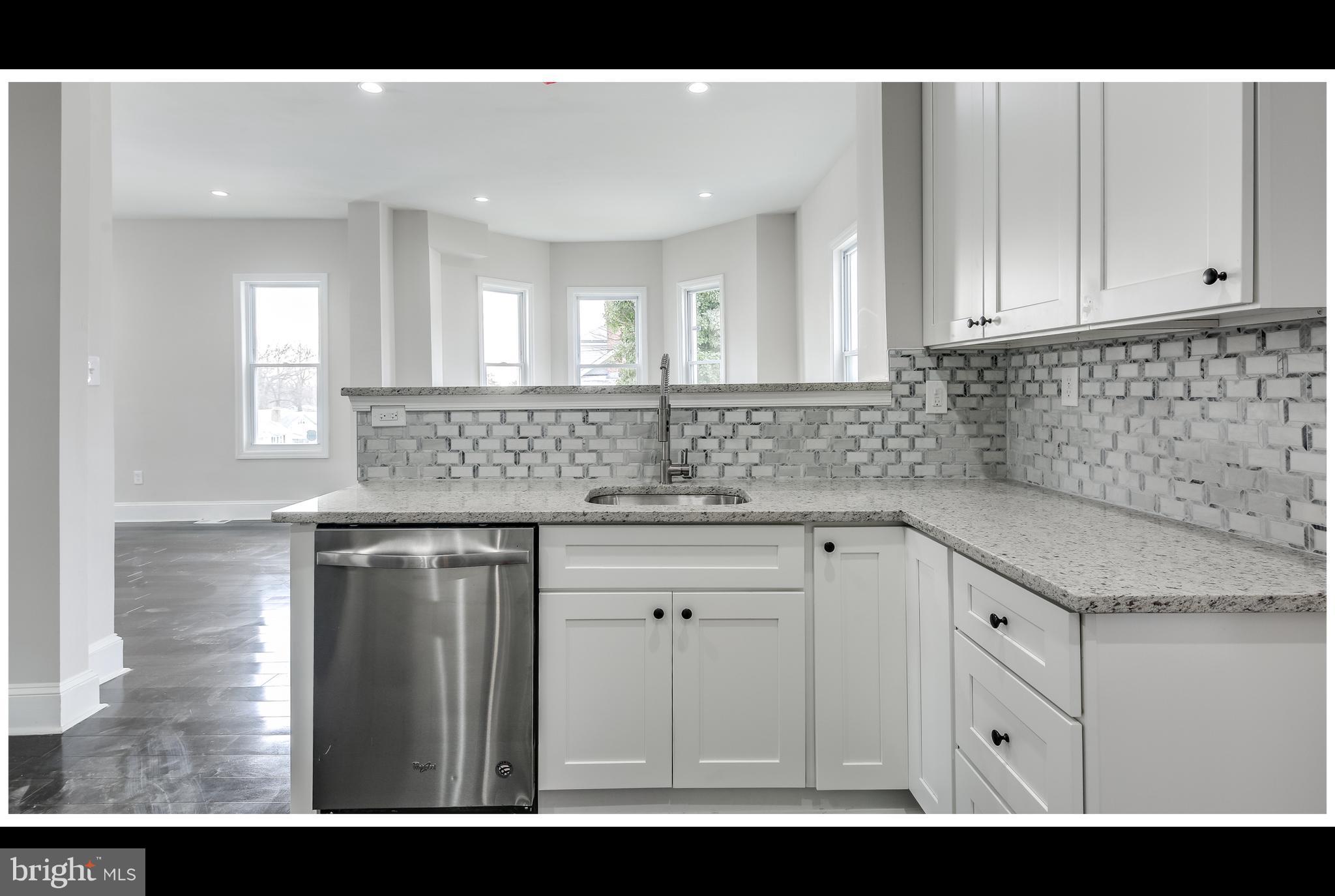 2900 Allendale Road Baltimore, MD 21216 - Photo 10 of 29 a kitchen with a sink and cabinets