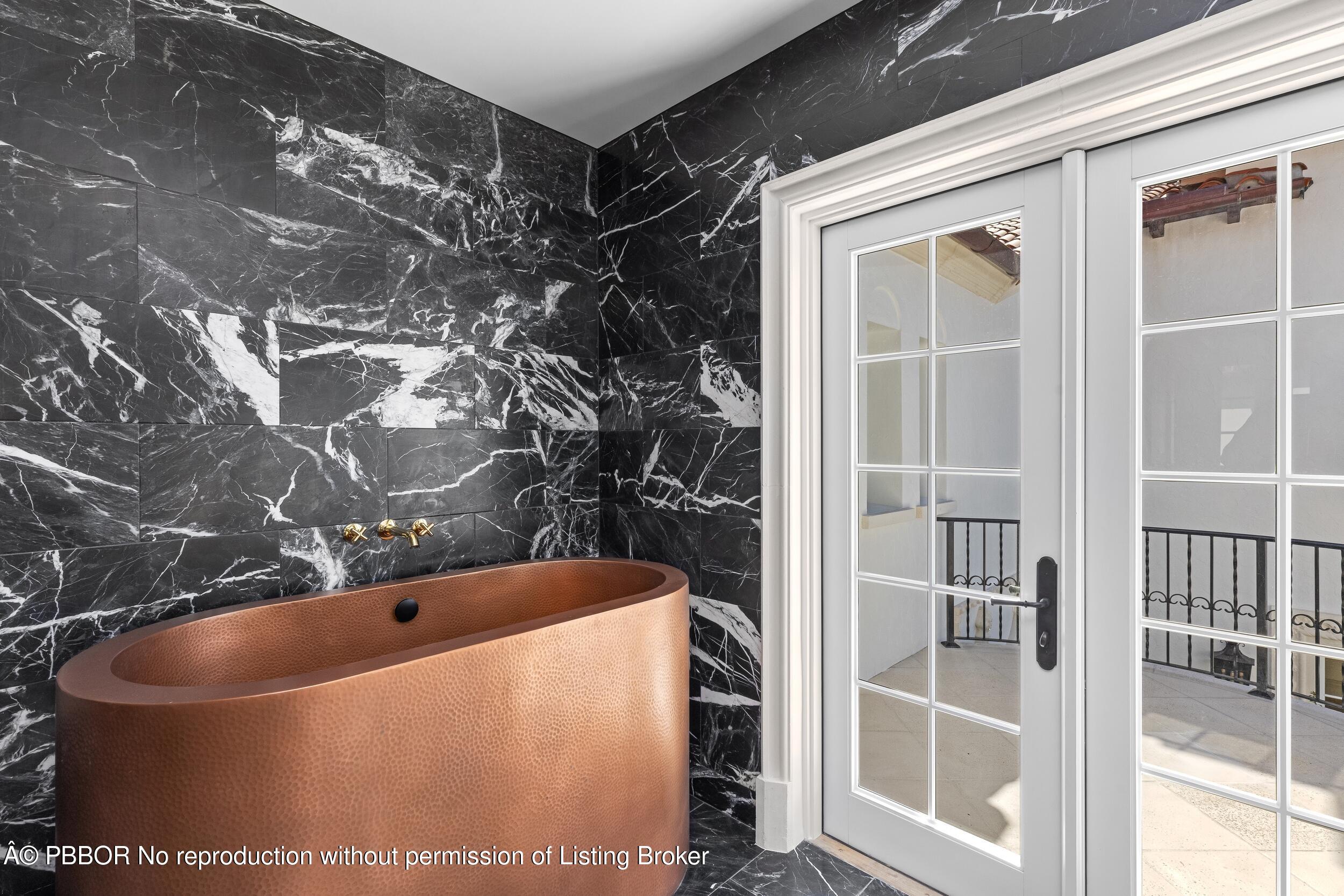 800 South County Road Palm Beach, FL 33480 - Photo 53 of 76 a bathroom with a bathtub
