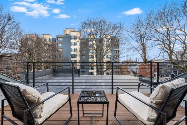 a view of a balcony with chairs