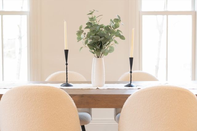 a vase of flowers sitting on a table