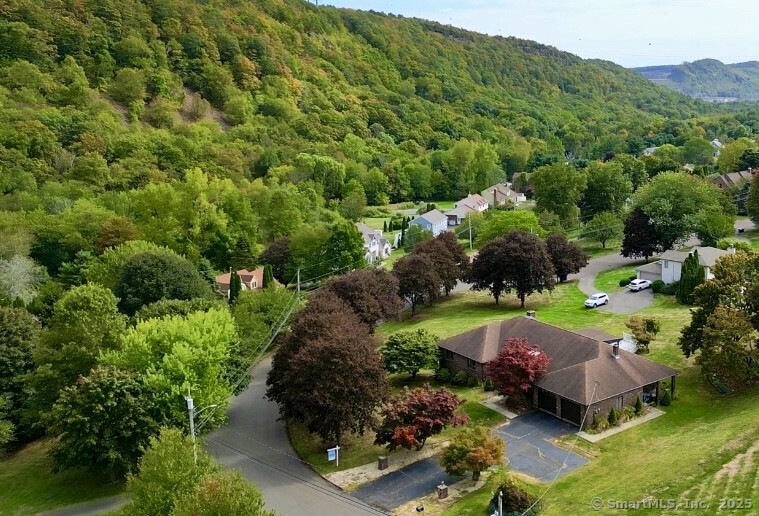 an aerial view of a house with a garden