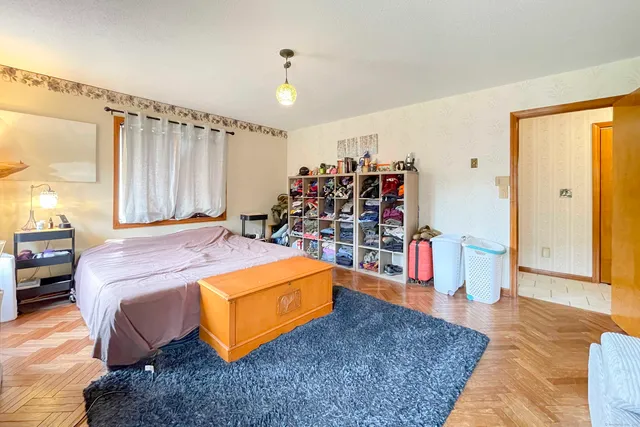 a bed room with a bed and a walk in closet