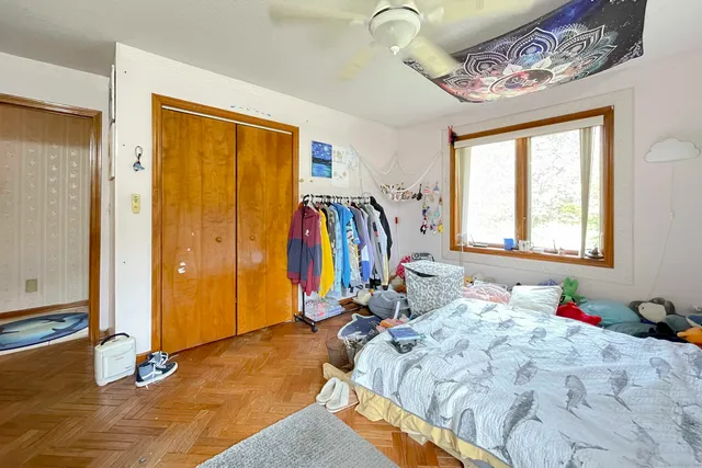 a bed room with a bed and a window