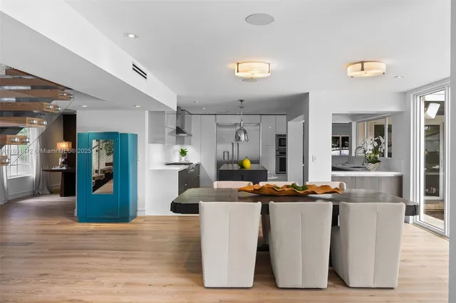 a spacious bedroom with a bed and a large window