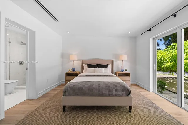 an aerial view of a house with yard swimming pool and outdoor seating