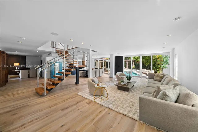 a bedroom with a large bed and a large window