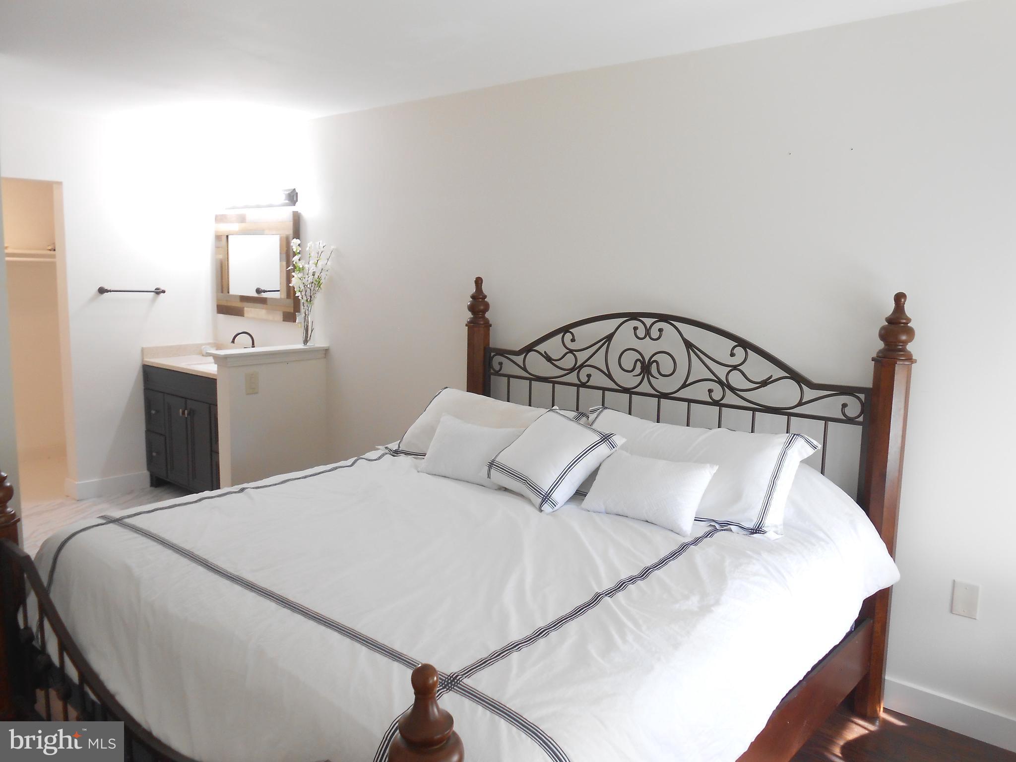 116 Cross Keys Road, Unit R116F Baltimore, MD 21210 - Photo 12 of 26 Spacious bright master bedroom.