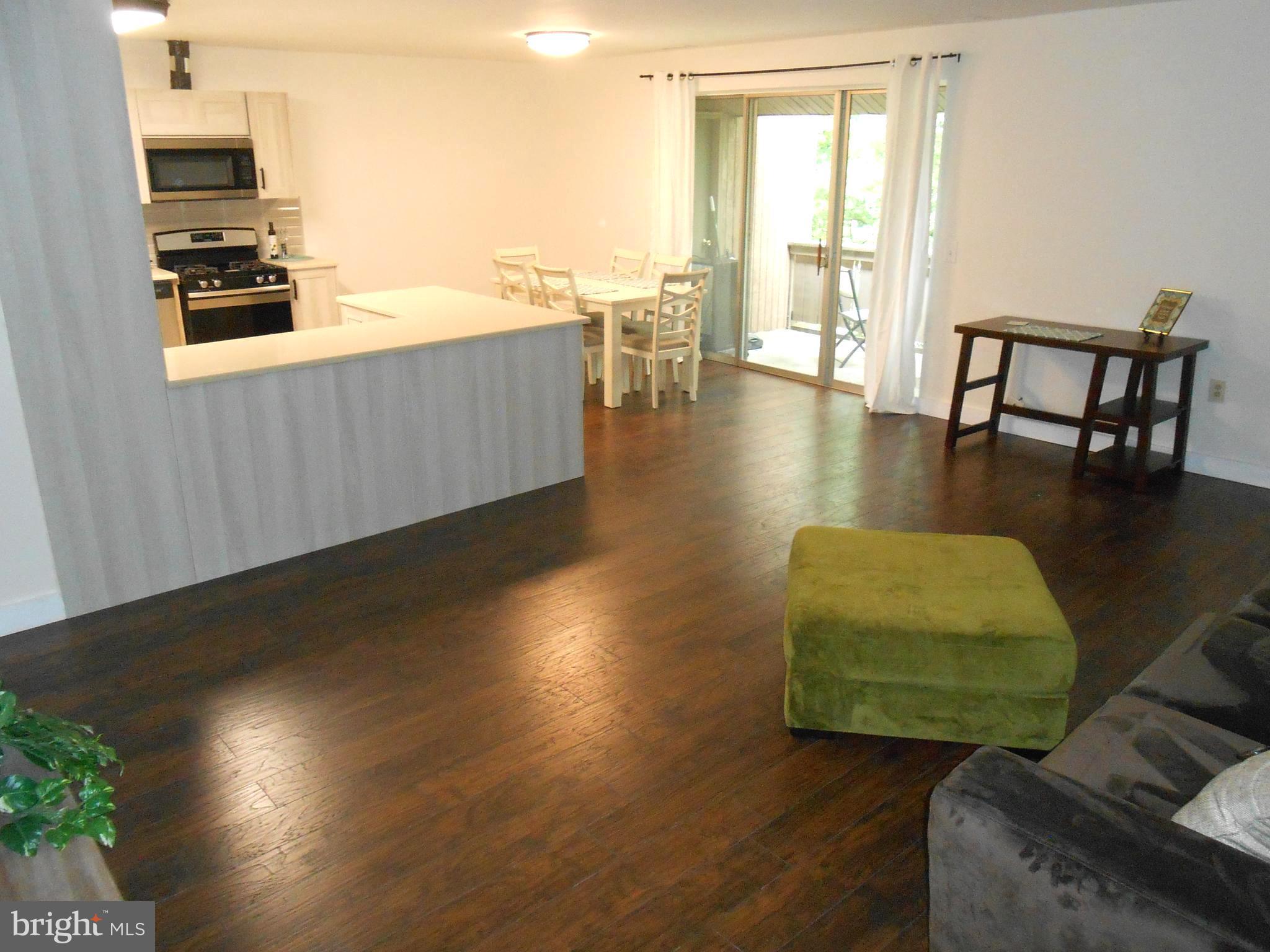 116 Cross Keys Road, Unit R116F Baltimore, MD 21210 - Photo 26 of 26 Open Floor Plan - New Wood Floor Through out