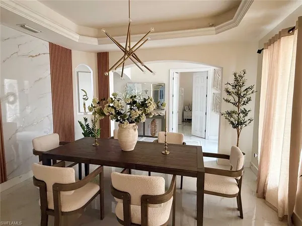 a view of a dining room with furniture and window