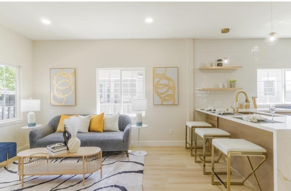 735 Locust Street San Jose, CA 95110 - Photo 8 of 21 a living room with furniture and a large window