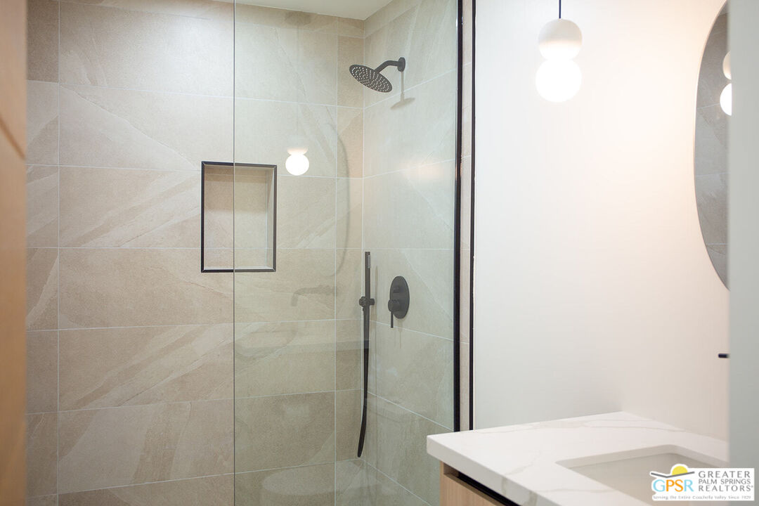 48940 Desert Flower Drive Palm Desert, CA 92260 - Photo 16 of 31 a bathroom with a shower