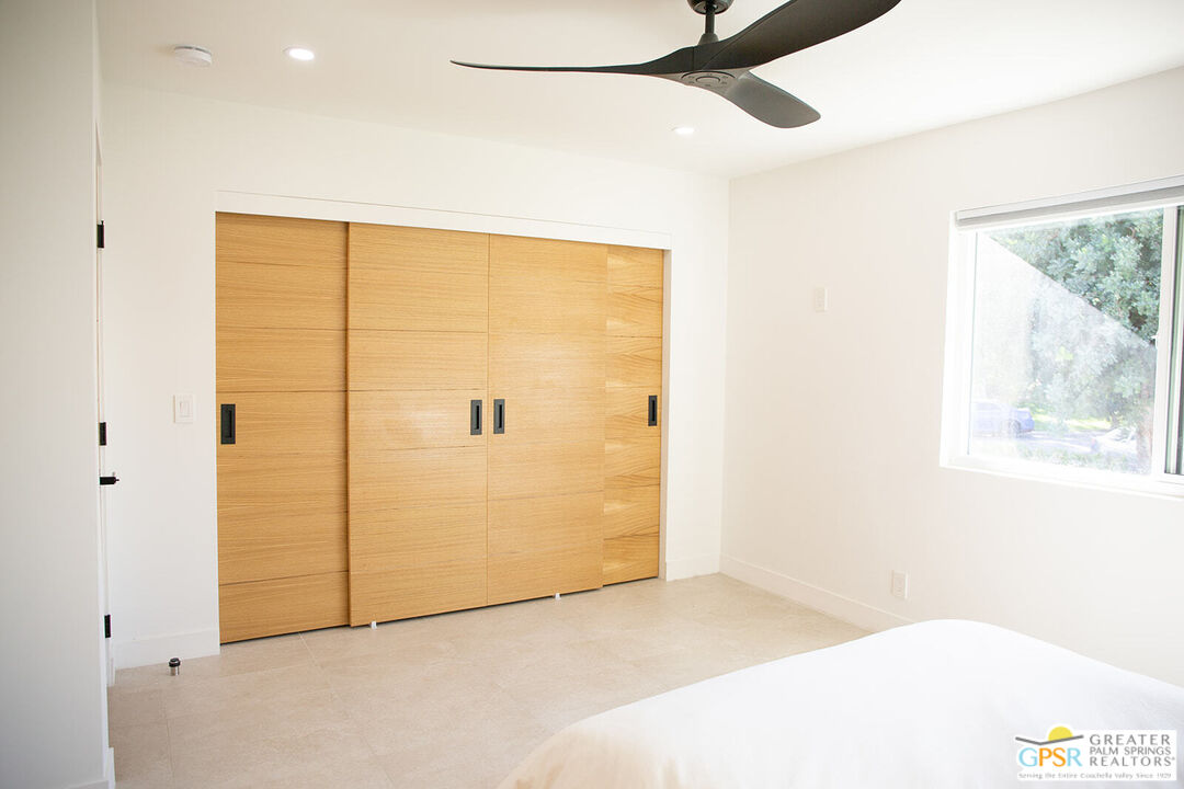48940 Desert Flower Drive Palm Desert, CA 92260 - Photo 18 of 31 a view of a big room with closet and windows