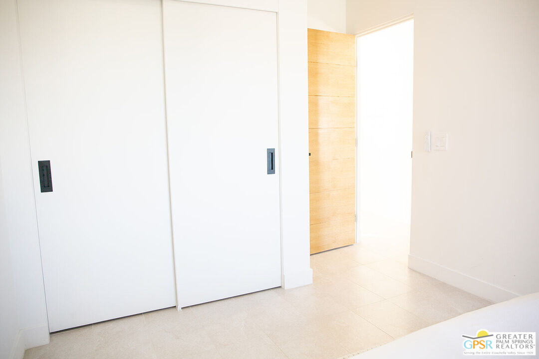 48940 Desert Flower Drive Palm Desert, CA 92260 - Photo 25 of 31 a picture of a room with a door