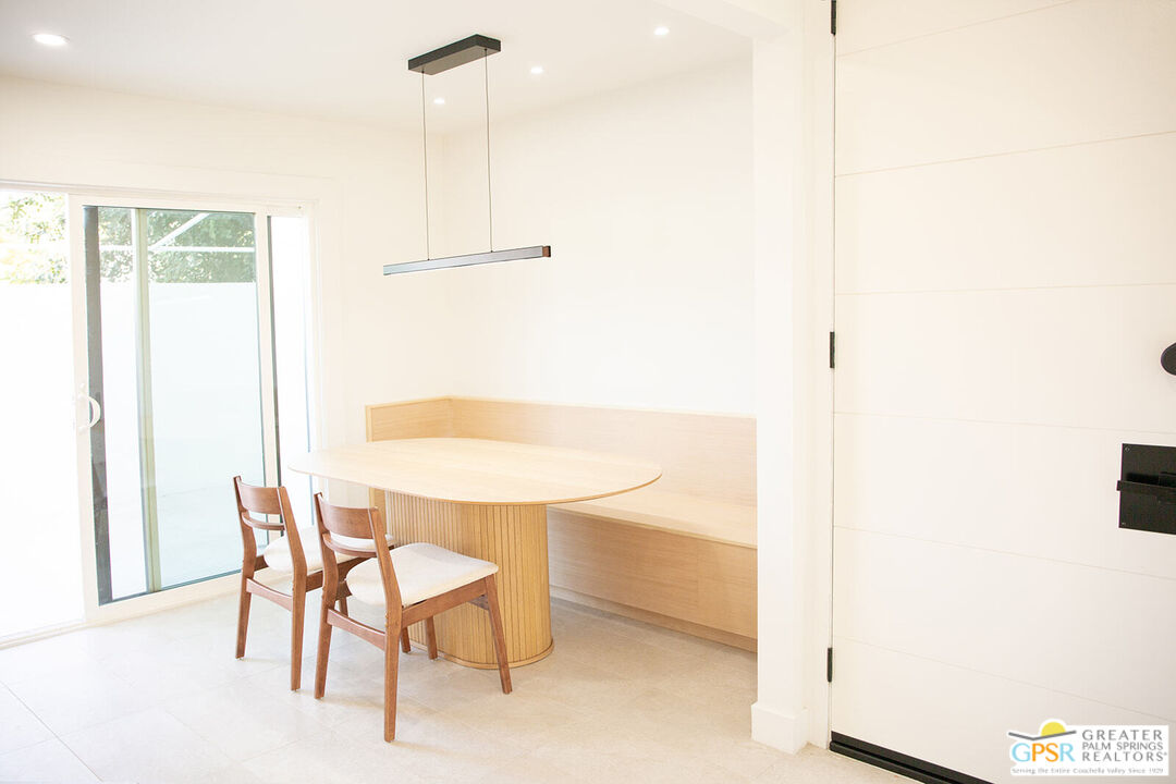 48940 Desert Flower Drive Palm Desert, CA 92260 - Photo 4 of 31 a dining room with furniture and a window