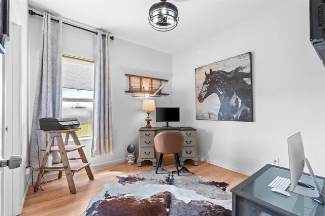 a workspace with furniture and a window