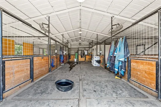 a bedroom with a bed a table and chair