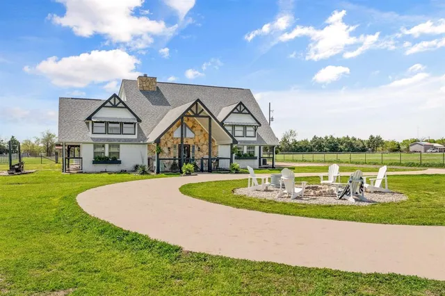 a swimming pool with outdoor seating and yard