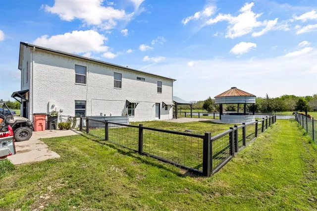 a view of a swimming pool with a yard