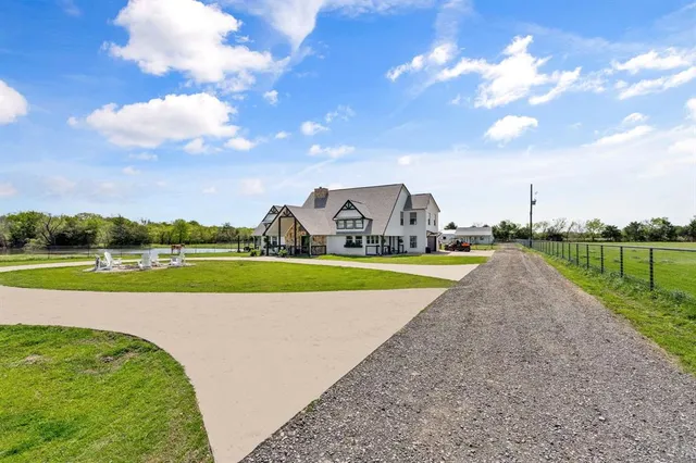 a view of building with swimming pool and green space