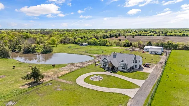 a view of a swimming pool with a yard
