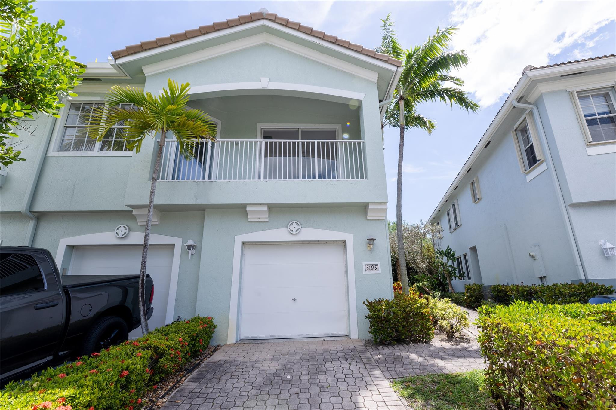 3199 Laurel Ridge Circle, Unit 3199 Riviera Beach, FL 33404 - Photo 1 of 44 a front view of house with yard outdoor seating and barbeque oven