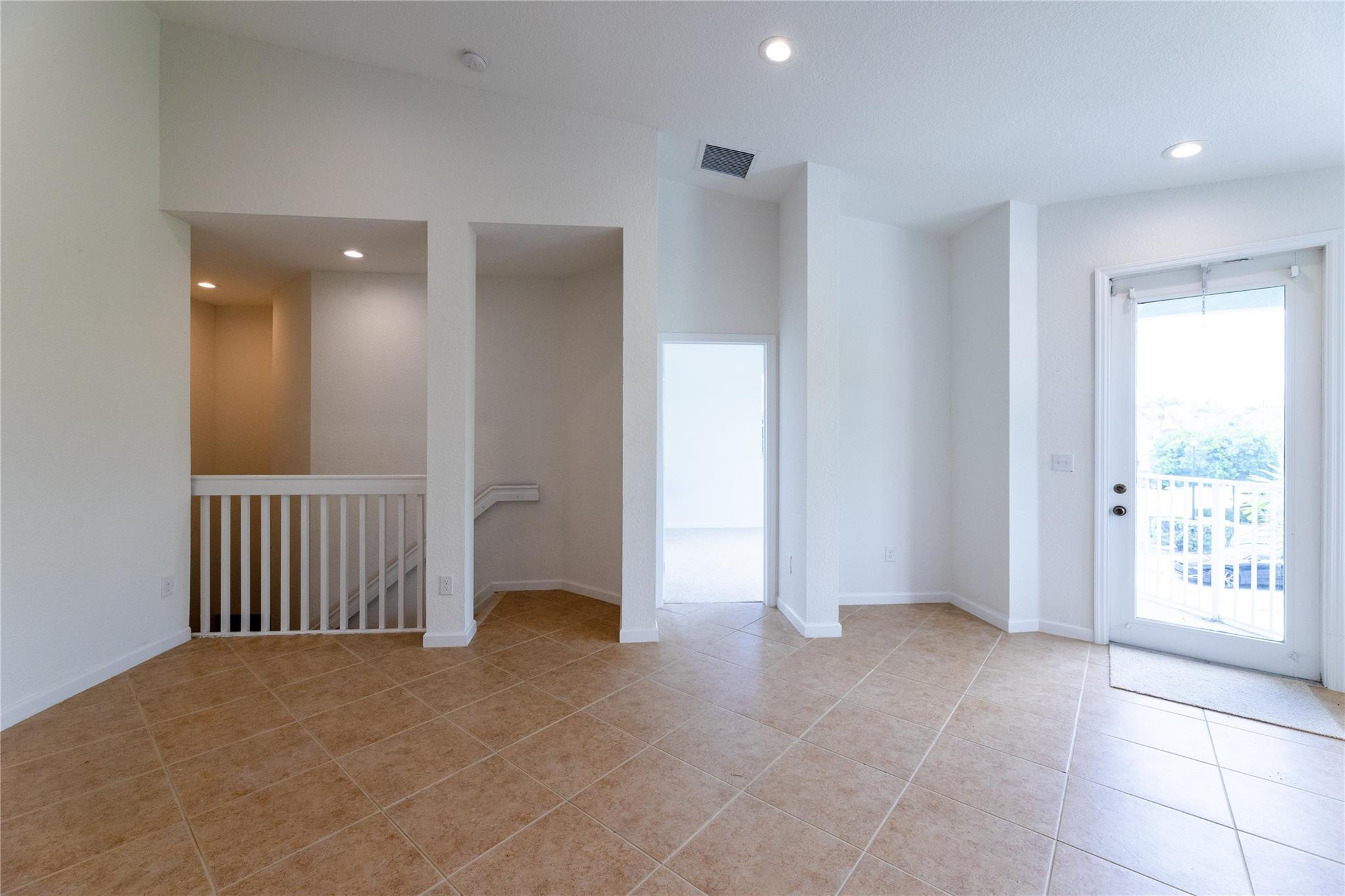 3199 Laurel Ridge Circle, Unit 3199 Riviera Beach, FL 33404 - Photo 12 of 44 a view of an empty room with a window