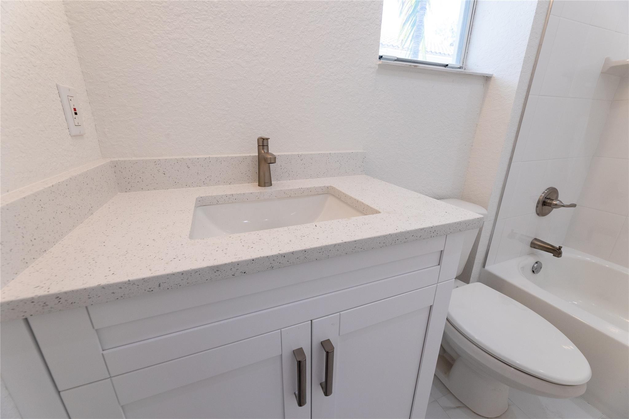 3199 Laurel Ridge Circle, Unit 3199 Riviera Beach, FL 33404 - Photo 16 of 44 a bathroom with a sink and a toilet