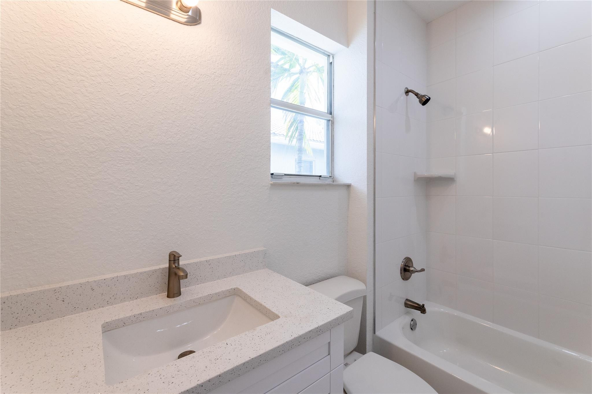 3199 Laurel Ridge Circle, Unit 3199 Riviera Beach, FL 33404 - Photo 17 of 44 a bathroom with a sink and a bathtub
