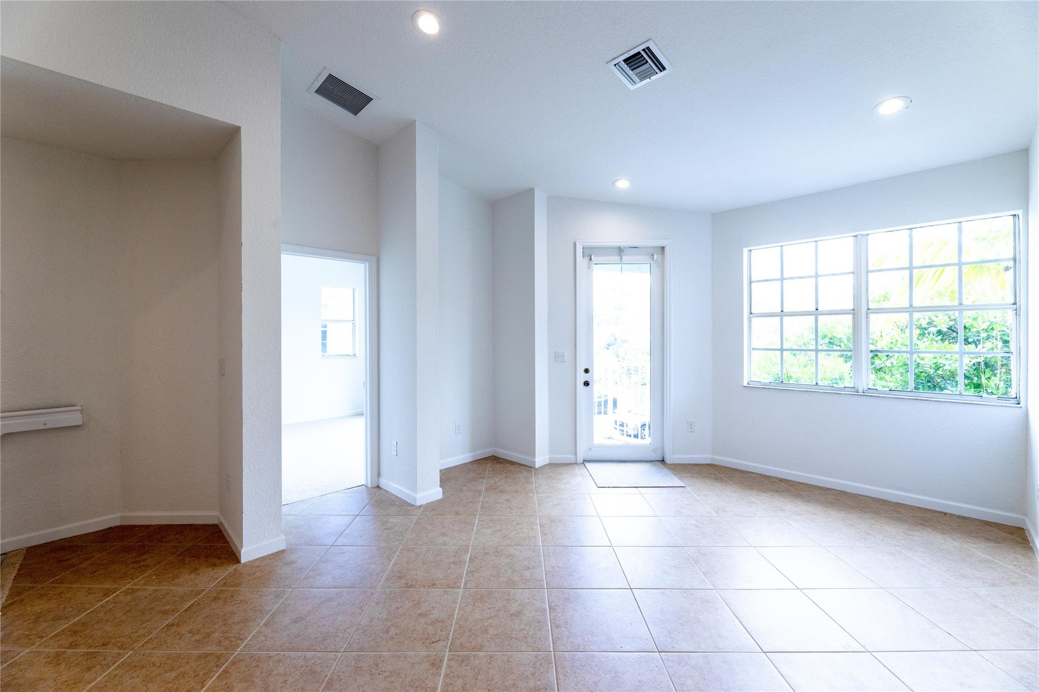 3199 Laurel Ridge Circle, Unit 3199 Riviera Beach, FL 33404 - Photo 18 of 44 a view of an empty room with a window