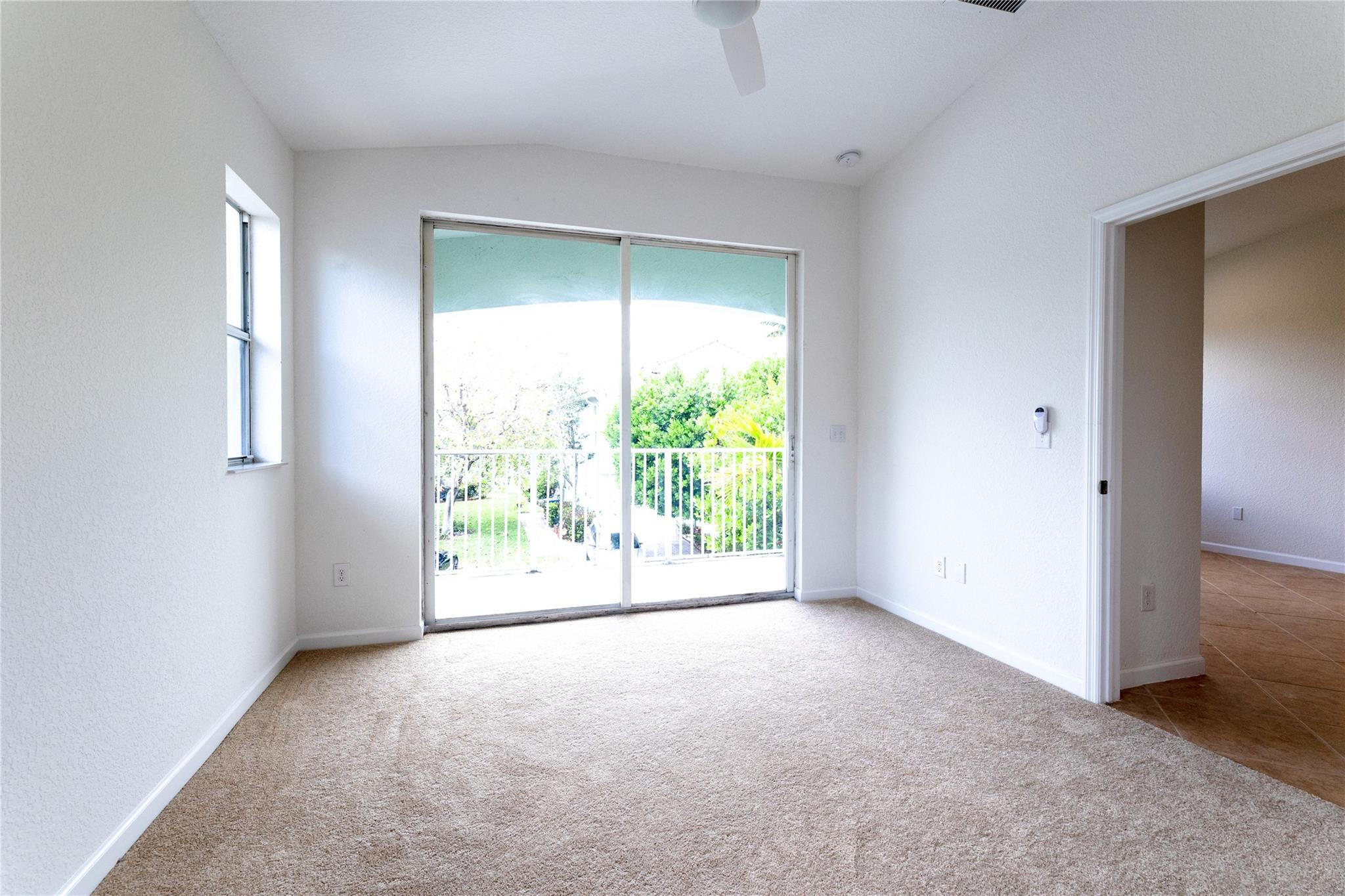 3199 Laurel Ridge Circle, Unit 3199 Riviera Beach, FL 33404 - Photo 29 of 44 a view of an empty room with a window