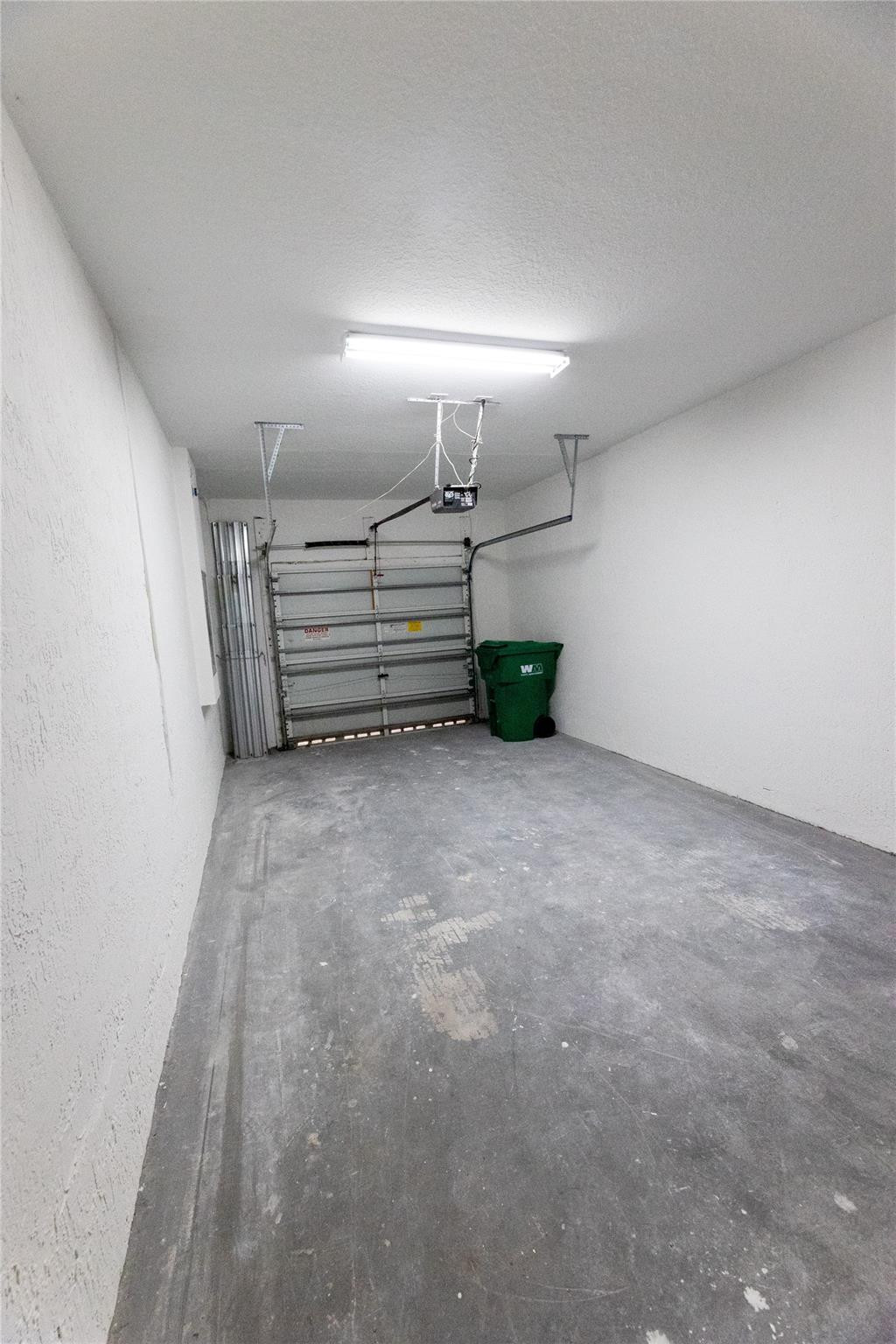 3199 Laurel Ridge Circle, Unit 3199 Riviera Beach, FL 33404 - Photo 31 of 44 a view of empty room with stairs and natural light
