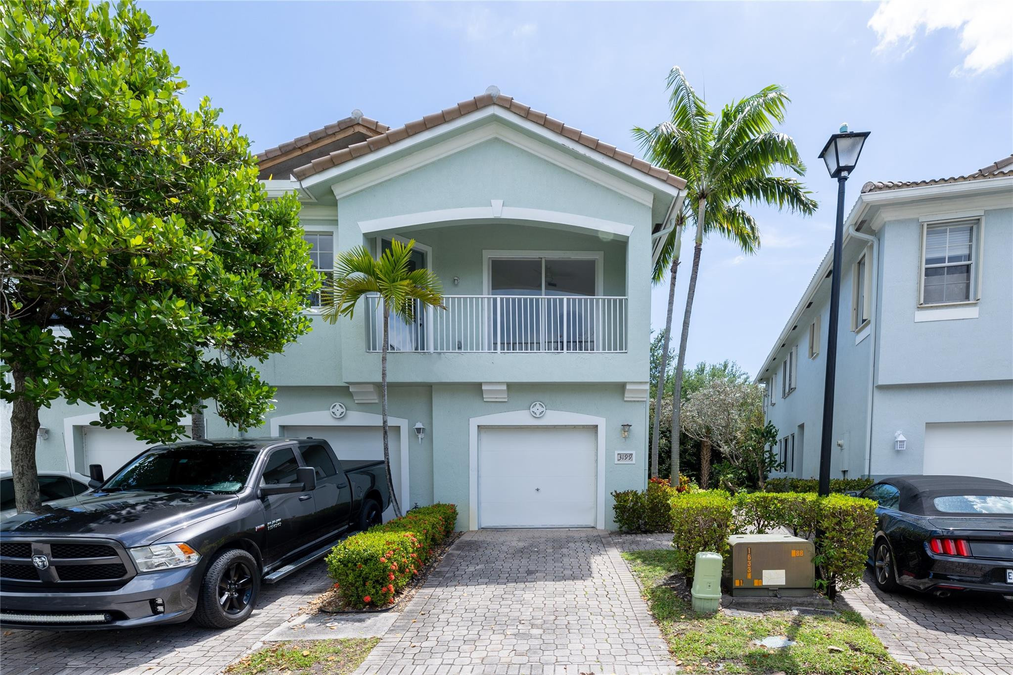3199 Laurel Ridge Circle, Unit 3199 Riviera Beach, FL 33404 - Photo 33 of 44 a car parked in front of a house