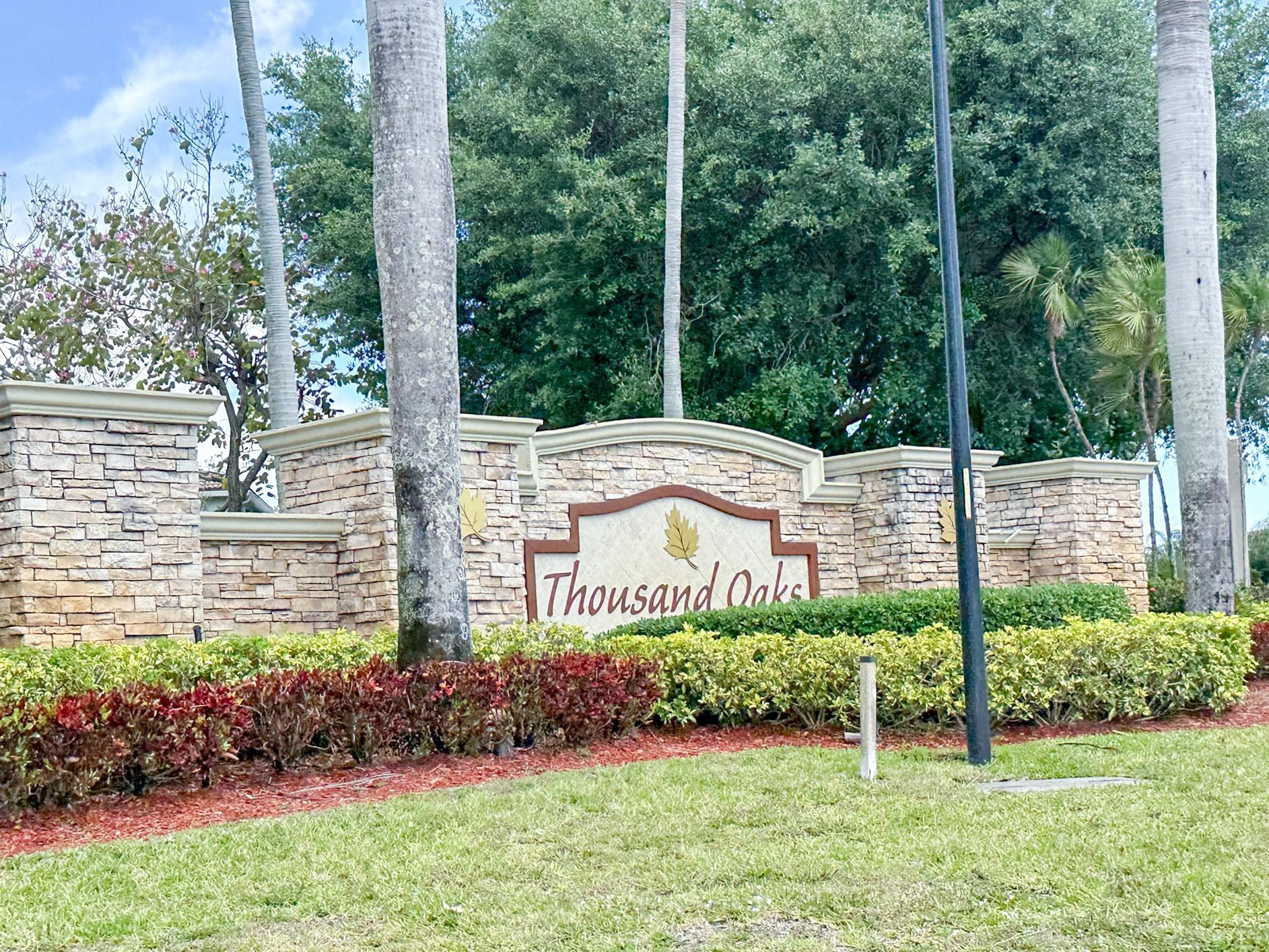 3199 Laurel Ridge Circle, Unit 3199 Riviera Beach, FL 33404 - Photo 34 of 44 a garden view with a seating space