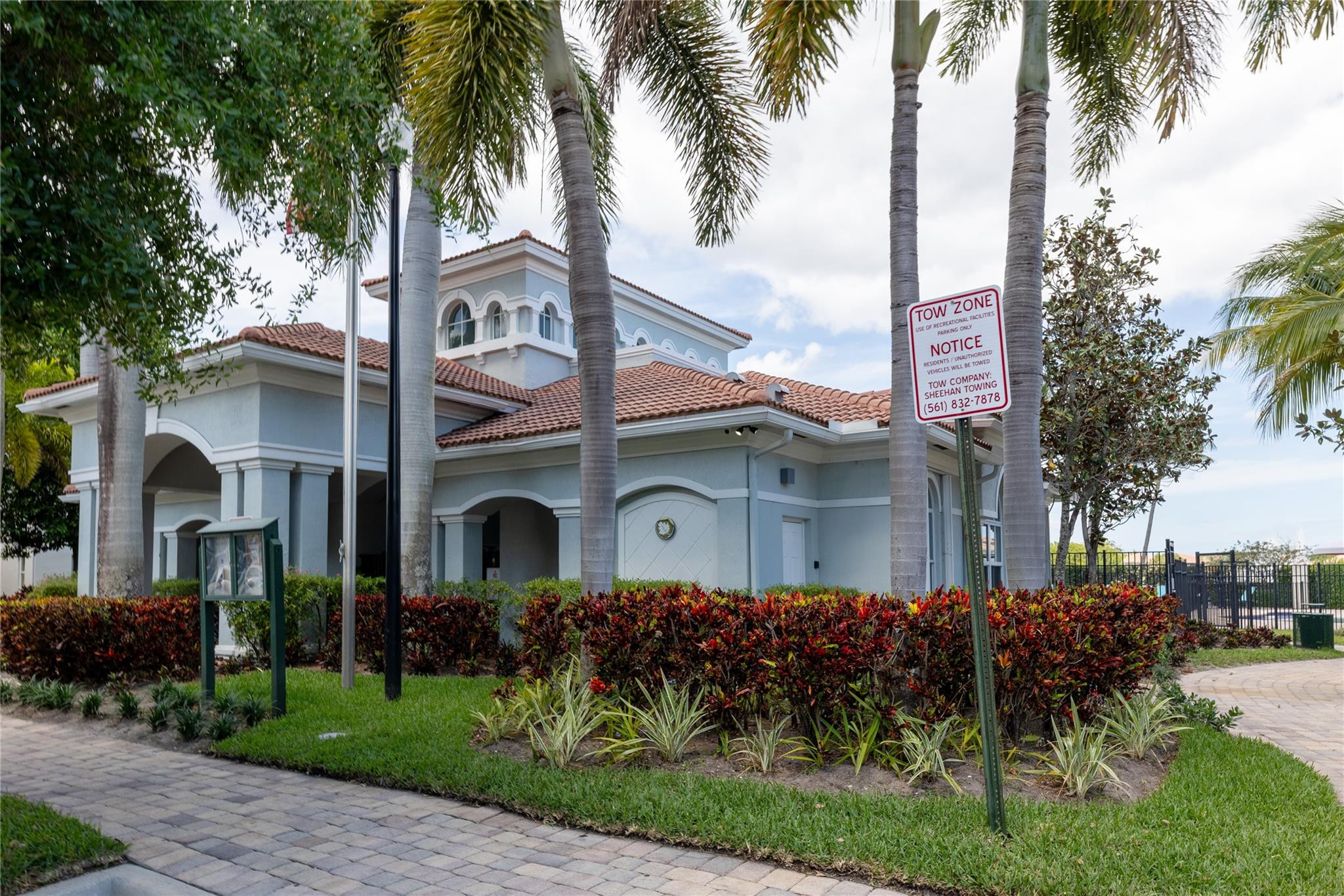 3199 Laurel Ridge Circle, Unit 3199 Riviera Beach, FL 33404 - Photo 36 of 44 a front view of multiple houses with yard
