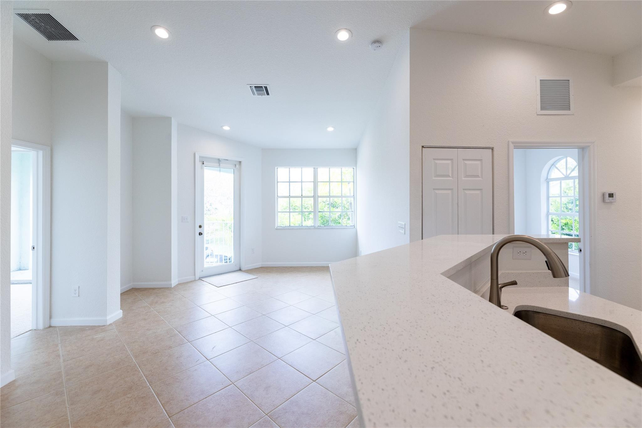3199 Laurel Ridge Circle, Unit 3199 Riviera Beach, FL 33404 - Photo 4 of 44 a bedroom with a bed and a large window