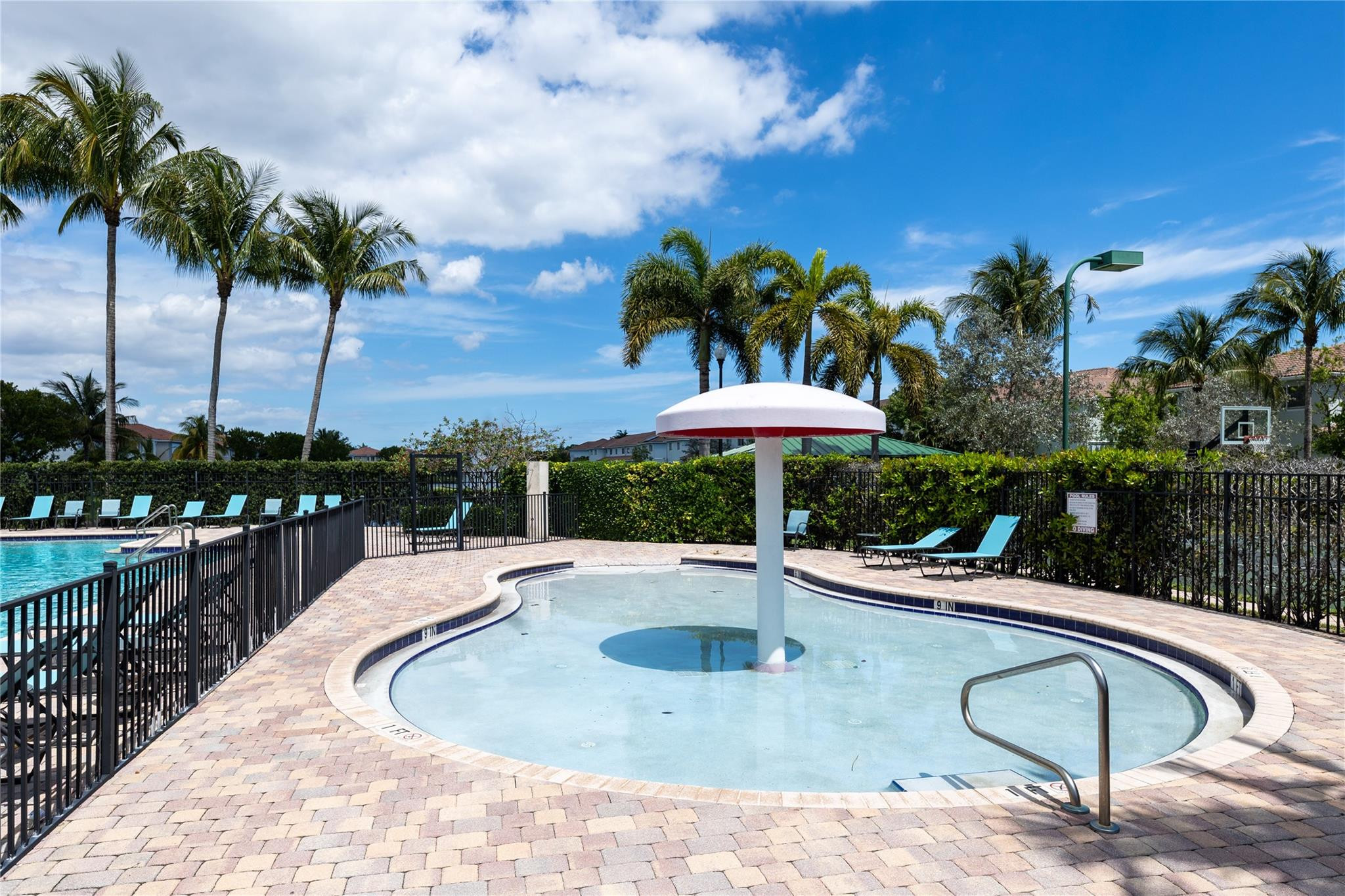 3199 Laurel Ridge Circle, Unit 3199 Riviera Beach, FL 33404 - Photo 42 of 44 a swimming pool with an outdoor seating