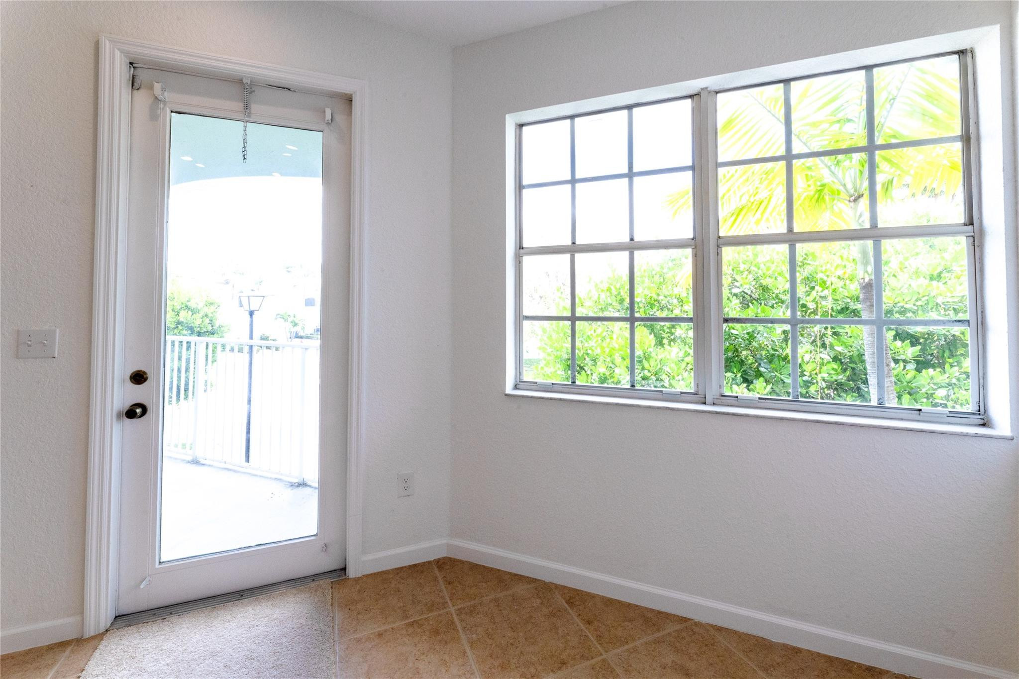 3199 Laurel Ridge Circle, Unit 3199 Riviera Beach, FL 33404 - Photo 6 of 44 a view of an empty room with a window