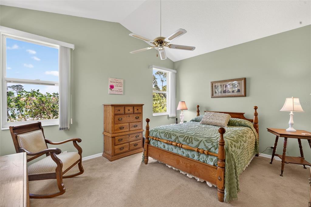4266 Summertree Road Venice, FL 34293 - Photo 18 of 64 a bedroom with a bed chair and window