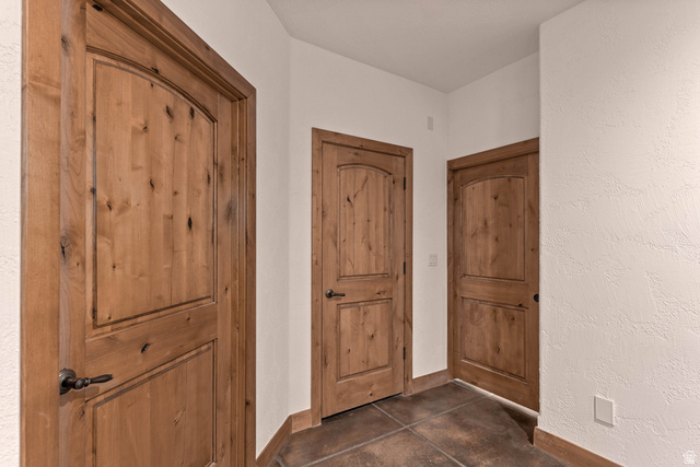 2464 East Granite Way St. George, UT 84790 - Photo 93 of 106 Great room looking towards staircase area, laundry room, utility closet, and storage room under the stairs