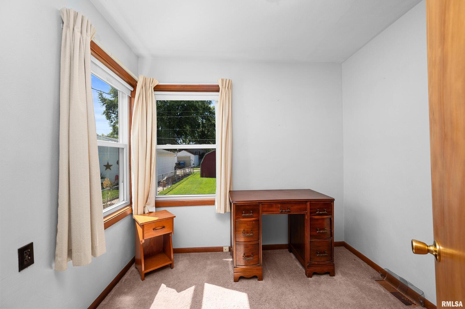 2375 31st Street, Unit A Moline, IL 61265 - Photo 12 of 26 a room with chair and a window