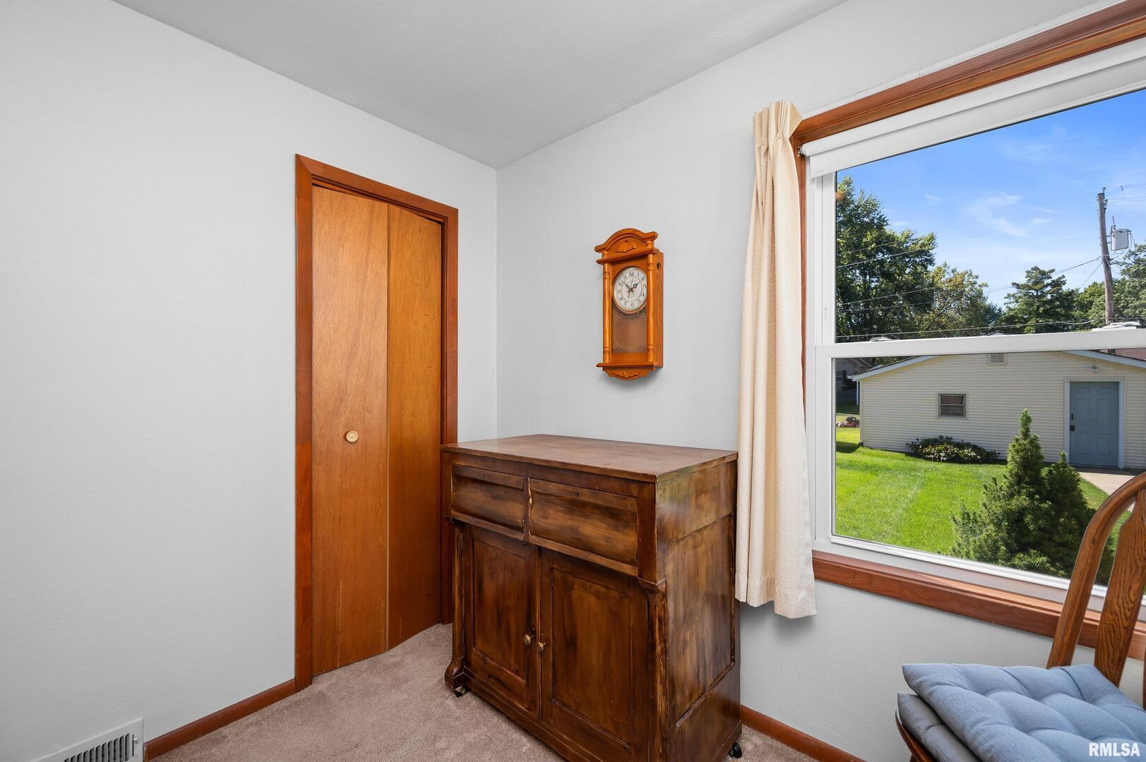 2375 31st Street, Unit A Moline, IL 61265 - Photo 14 of 26 a view of a hallway with paintings on the wall