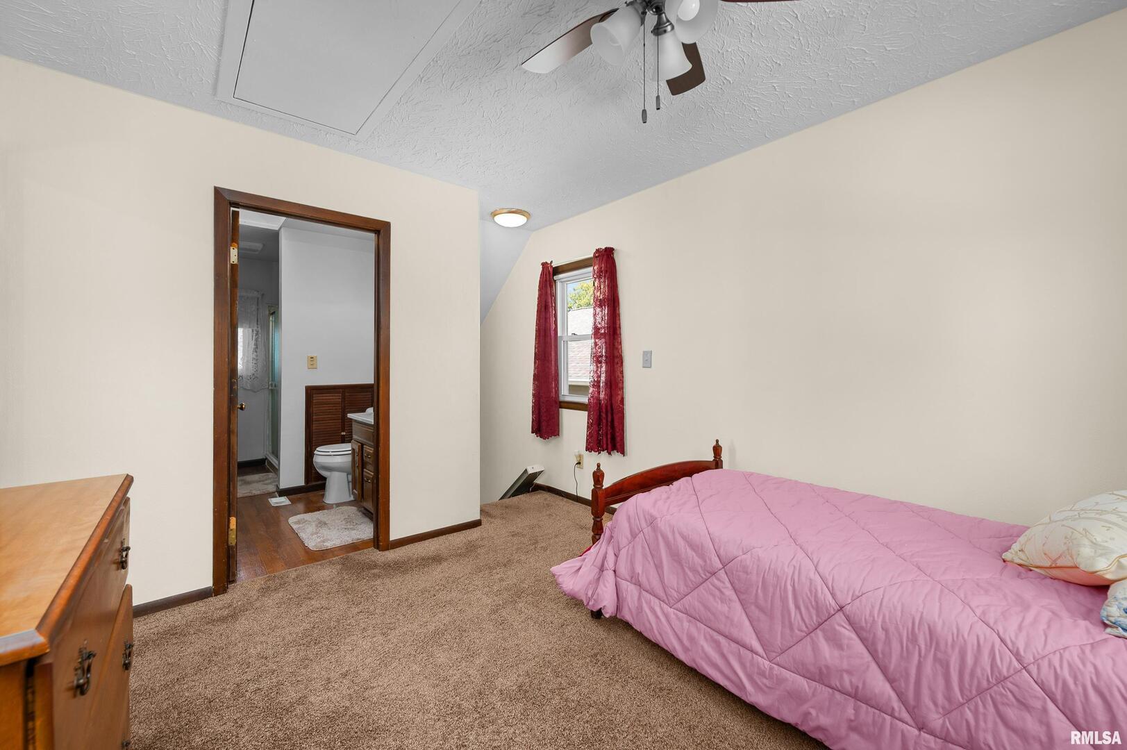 2375 31st Street, Unit A Moline, IL 61265 - Photo 16 of 26 a bedroom with a bed and a desk