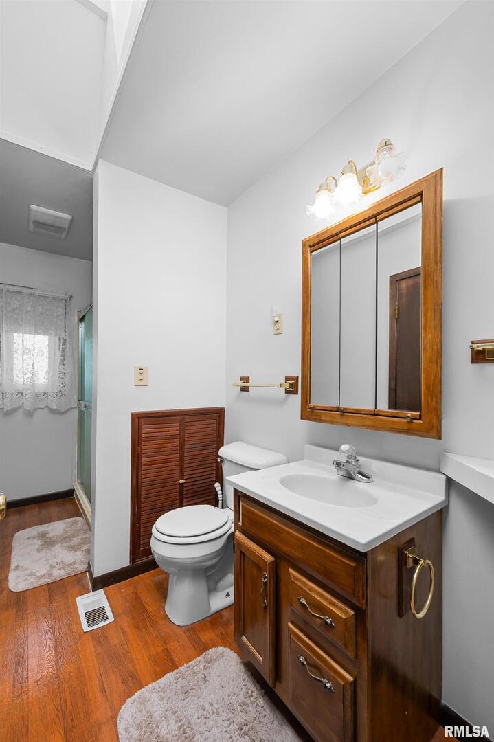 2375 31st Street, Unit A Moline, IL 61265 - Photo 17 of 26 a bathroom with a sink and a toilet
