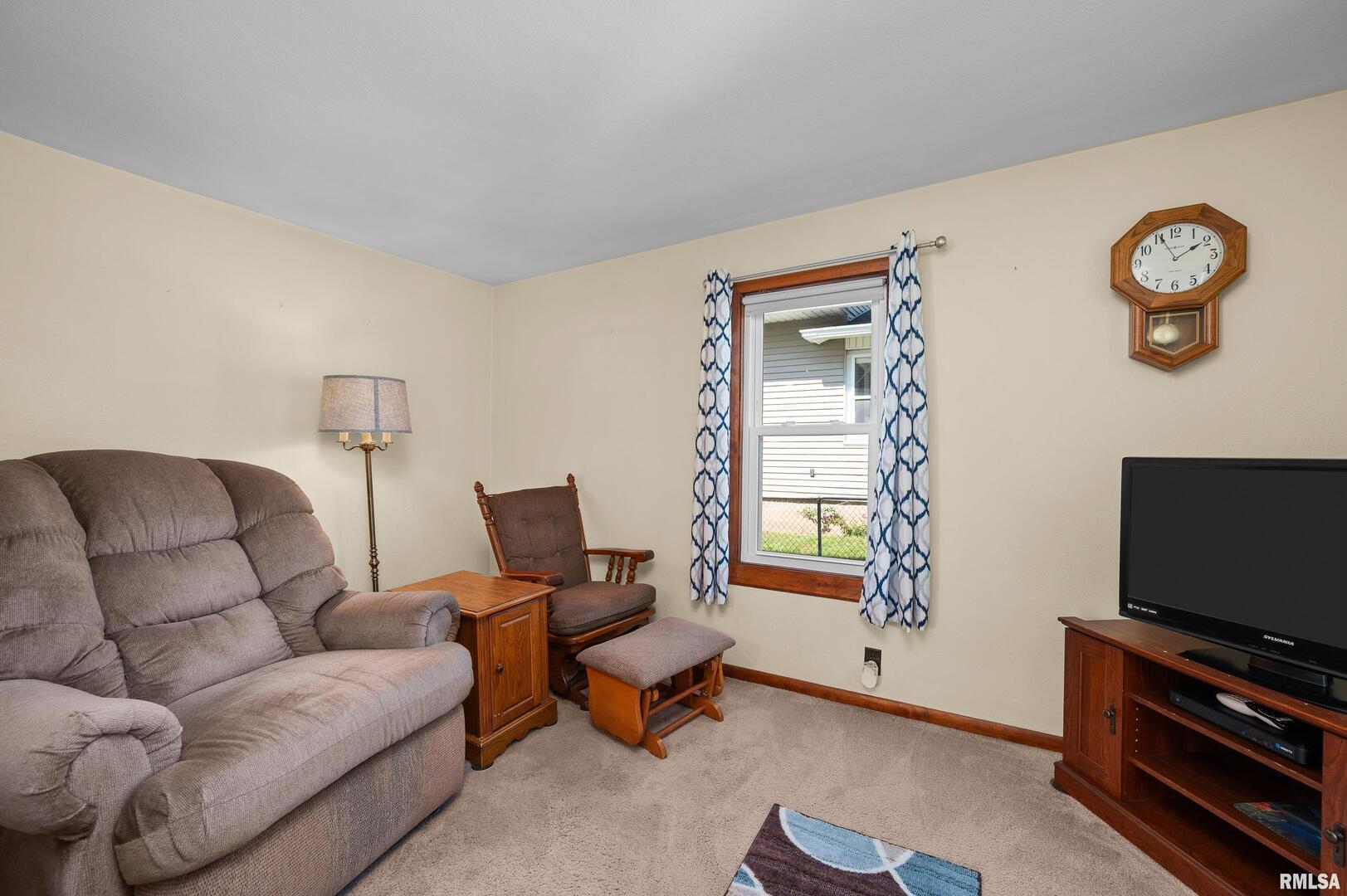 2375 31st Street, Unit A Moline, IL 61265 - Photo 6 of 26 a living room with furniture and a flat screen tv