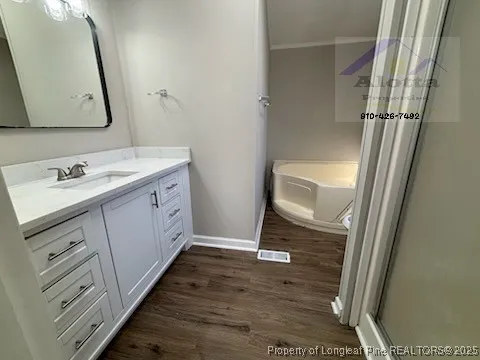 a bathroom with a sink a mirror and a shower